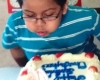 Kid blowing a candle