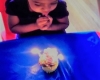 Kid blowing a candle