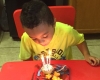 Kid blowing a candle